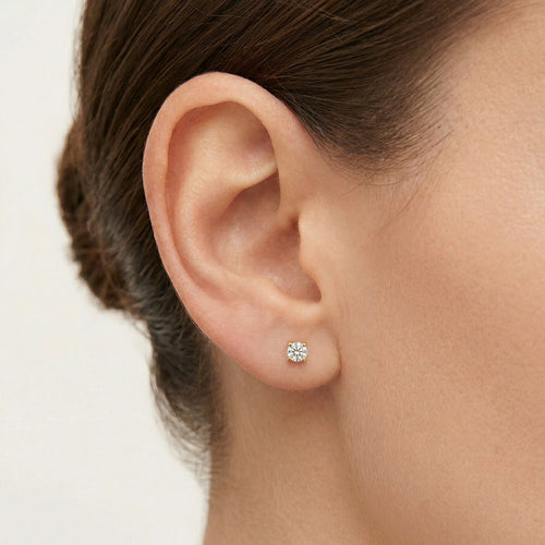 Yellow gold stud earrings with round cubic zirconia