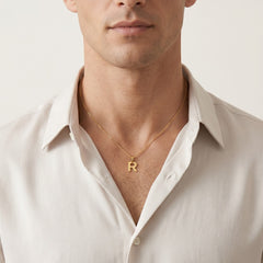 Gold pendant of letter R