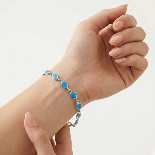Sterling silver bracelet with blue opal accents