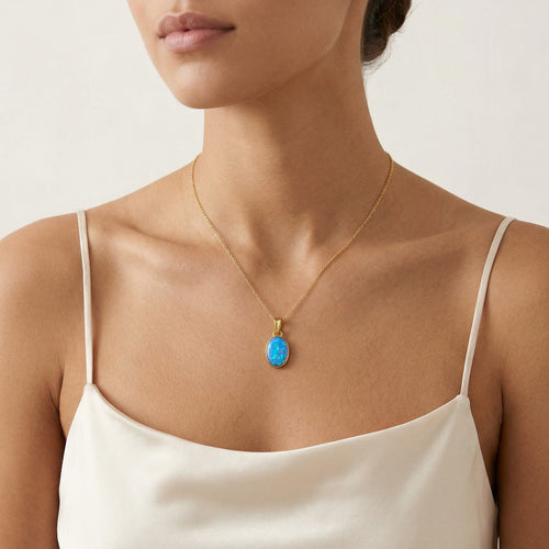 Pendentif simple en or avec opale bleue