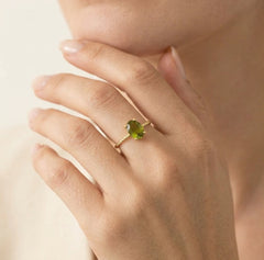 Oval moldavite gold ring with delicate details