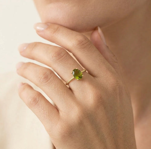 Oval moldavite gold ring with delicate details