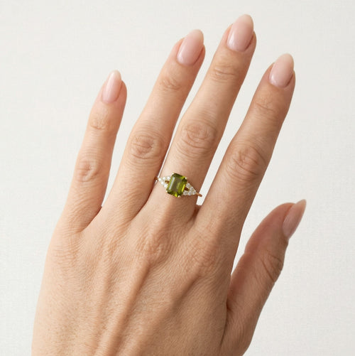 Stylish emerald cut moldavite ring with cubic zirconia