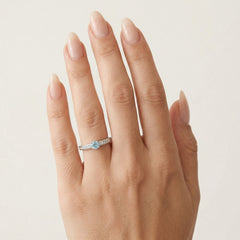 Elegant white gold ring with diamond and blue topaz
