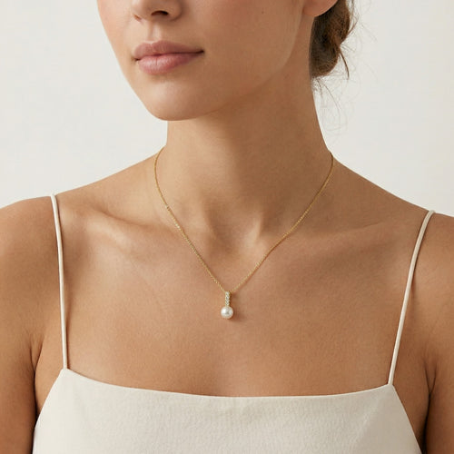 pendentif en or avec perle accentuée