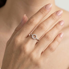 White gold ring with small circle of diamonds