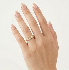 Thin channel-set cubic zirconia gold band