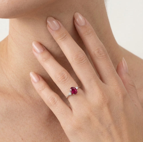 White gold oval ruby ring with diamonds