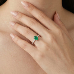 White gold ring with oval emerald and diamonds