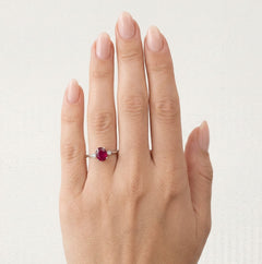 White gold oval ruby ring with diamonds