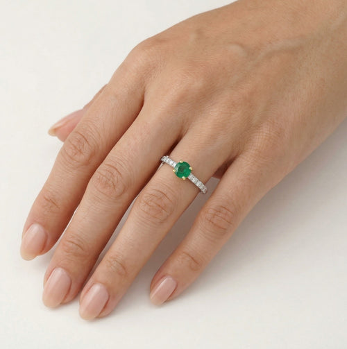 Elegant round cut emerald and diamond ring