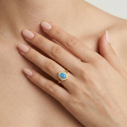 Královský zlatý prsten s modrým opálem