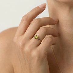 Enchanting moldavite and garnet gold ring