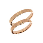 Bague de mariage en or rose avec symboles