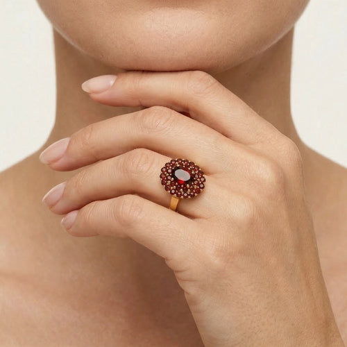Oval and double round row garnet radiance ring