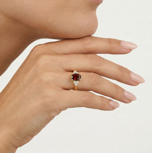 Elegant gold ring with garnet and cubic zirconia