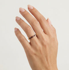 Long channel set garnet gold ring