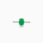 White gold ring with oval emerald and diamonds