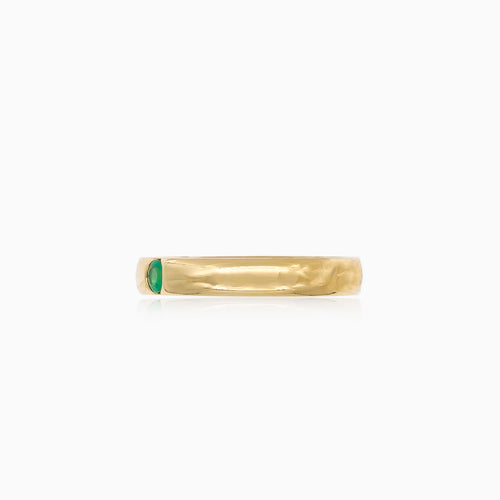 Simple gold ring with small emerald