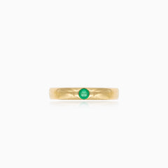 Simple gold ring with small emerald