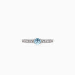Elegant white gold ring with diamond and blue topaz