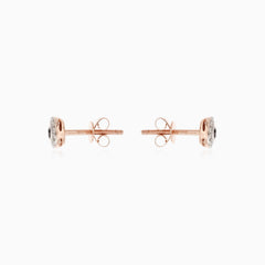 Stylish rose gold earrings with black and white diamonds
