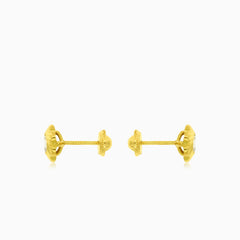 Boucles d’oreilles en or avec fleur et zirconium cubique au centre