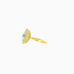 Yellow gold ring with sky blu topaz