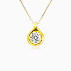Zlatý přívěsek s kulatým zirkonem osazeným v lunetě