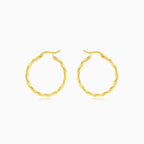 Yellow gold twist polished hoop earring