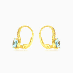 Pendientes de topacio azul y circonitas cúbicas en oro