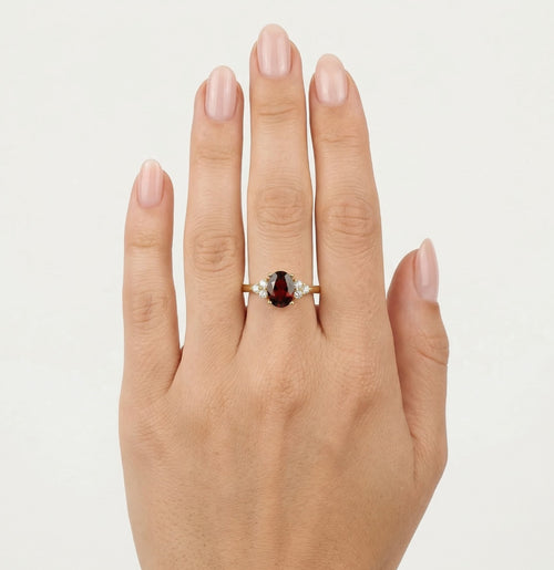 Elegant gold ring with garnet and cubic zirconia