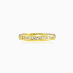 Thin channel-set cubic zirconia gold band