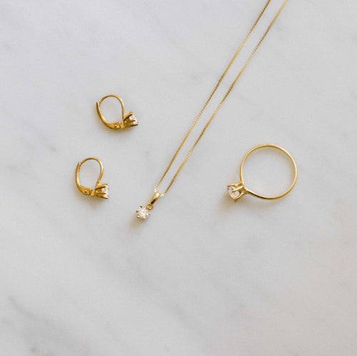 Six prong gold drop earrings