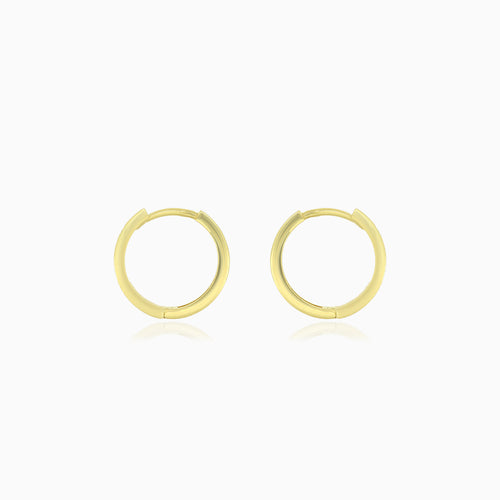 Boucles d’oreilles créoles en or jaune avec zirconium