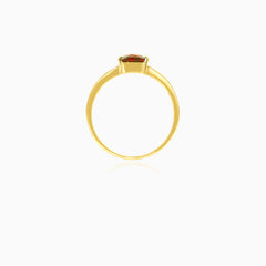 Princess cut solitaire garnet yellow gold ring