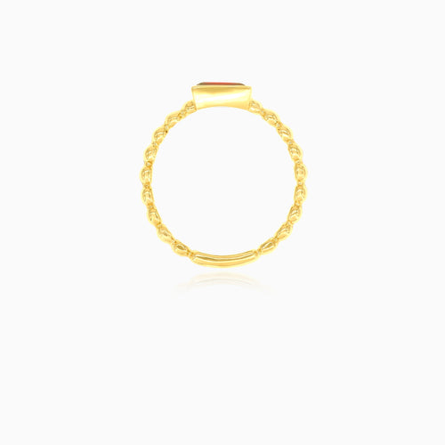 Bague avec grenat taille émeraude en sertissage clos