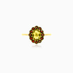 Moldavite and garnet ring in yellow gold