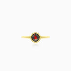 Simple yellow gold ring with solitaire garnet