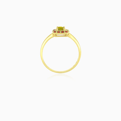 Yellow gold ring with round moldavite and garnet