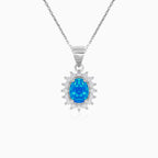 Sterling silver halo pendant with blue opal
