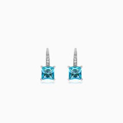 Sterling silver drop earrings with blue topaz
