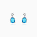Halo sterling silver drop earrings with blue topaz
