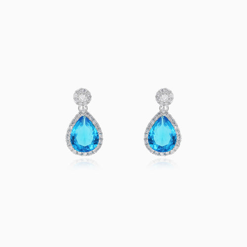 Halo sterling silver drop earrings with blue topaz