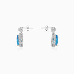 Halo sterling silver drop earrings with blue topaz
