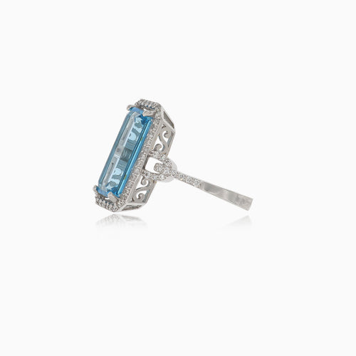 Elegant blue topaz baguette ring in white gold