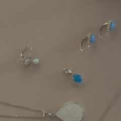 Sterling silver halo white pear opal earrings