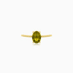 Oval moldavite gold ring with delicate details