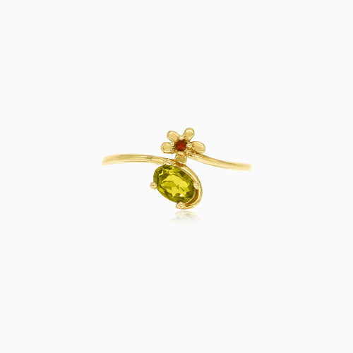 Bague en or avec moldavite ovale, accents floraux et grenats