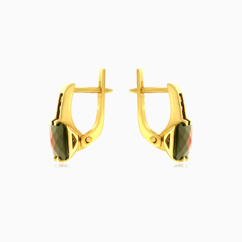 Goldene Tropfen mit strahlender Ausstrahlung